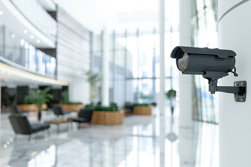 CCTV camera installed in a modern commercial lobby