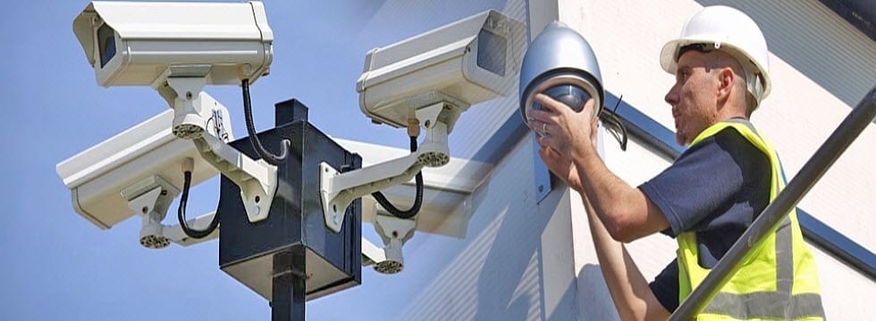 Technician installing a CCTV camera